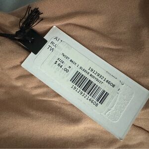 Twist back pink body suit